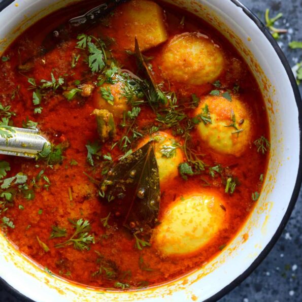 https://www.pontalo.net - Aloo Konir Dom Recipe (Assamese Egg & Potato Curry)