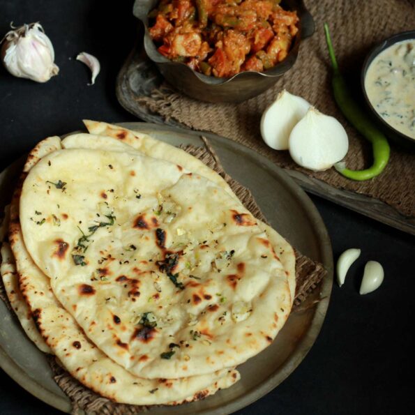 https://www.pontalo.net - Butter Garlic Naan Recipe - Garlic Flavoured Flatbread