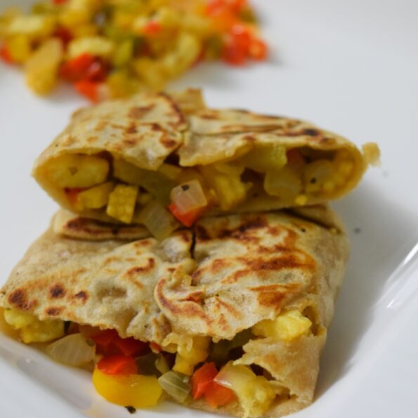 https://www.pontalo.net - Stuffed Corn and Capsicum Paratha Recipe with Herbs