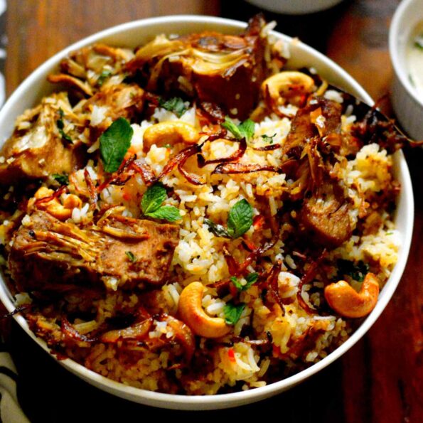 https://www.pontalo.net - Kathal Biryani Recipe- Raw Jackfruit Biryani Topped with Caramelised Onions