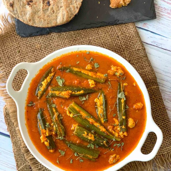 https://www.pontalo.net - Paneer Stuffed Bhindi In Ajwain Tomato Gravy Recipe