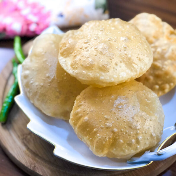 https://www.pontalo.net - Puri Recipe - Learn to Make Soft Puffed Puris At Home