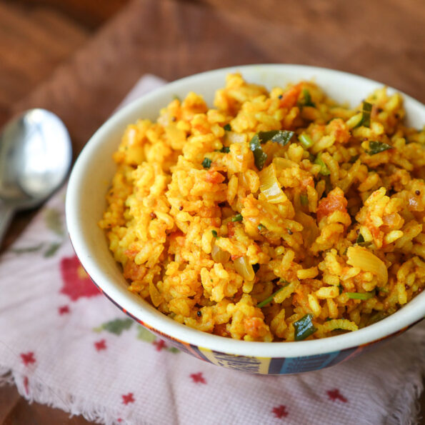 https://www.pontalo.net - Thakkali Sadam Recipe - Spicy Tomato Rice