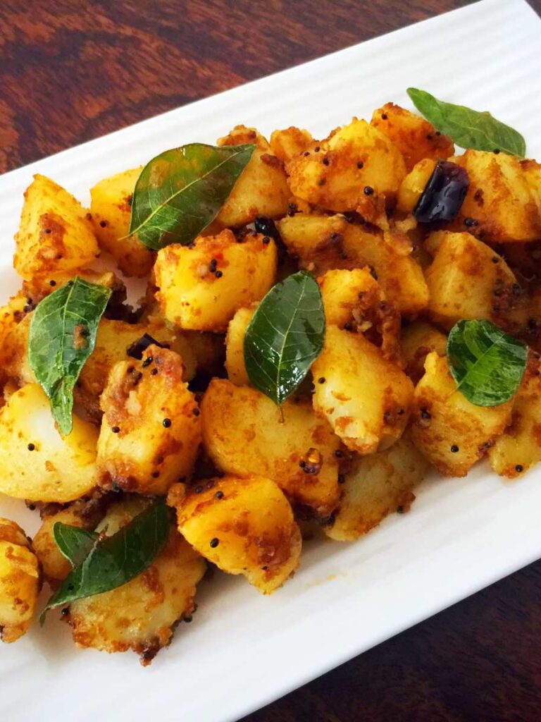 https://www.pontalo.net - Urulaikizhangu Puli Thokku Recipe (South Indian Style Potatoes with Tamarind)