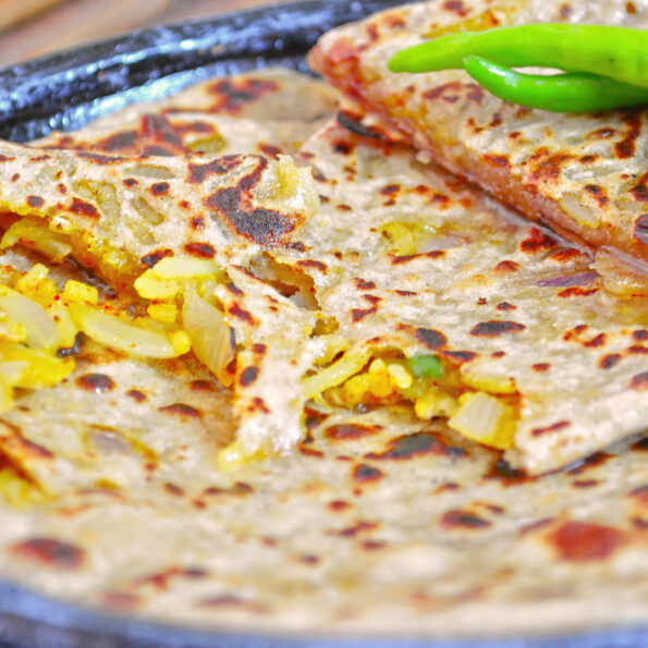 https://www.pontalo.net - Spicy Rice Stuffed Paratha Recipe