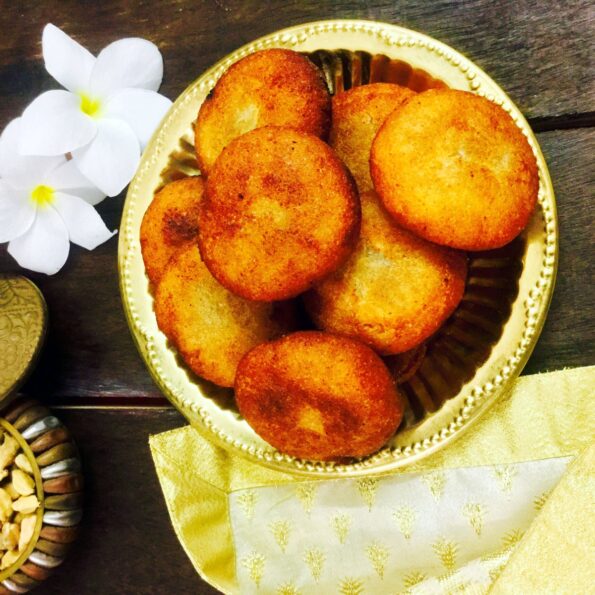 https://www.pontalo.net - Suji Manda Pitha/Sweetened Coconut Stuffed Semolina Dumplings Recipe